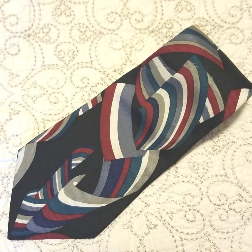 Givenchy Monsieur 100% silk tie. Multi-colored ribbon on black background. USA
